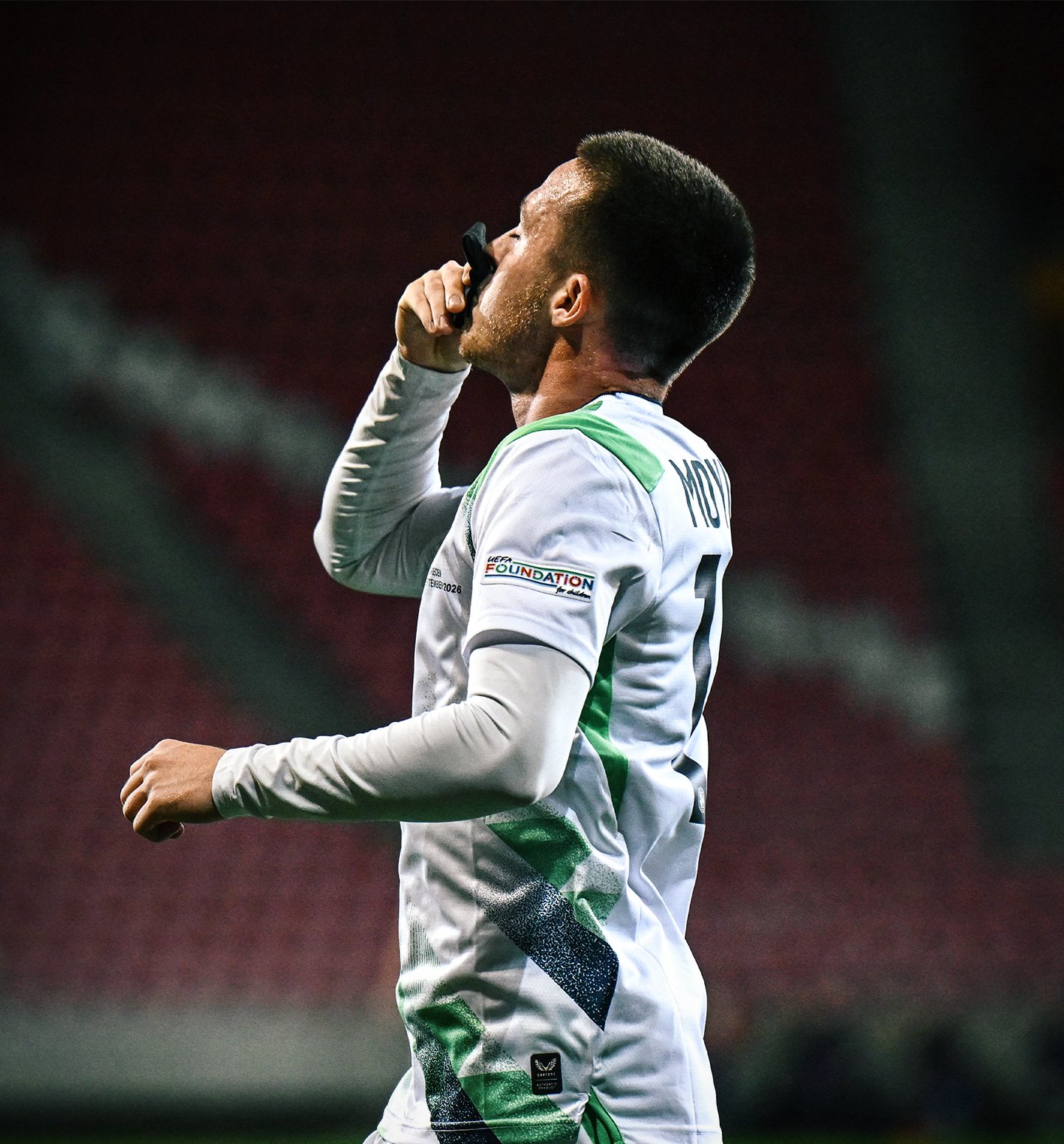 Jack Moylan kisses his black armband after scoring