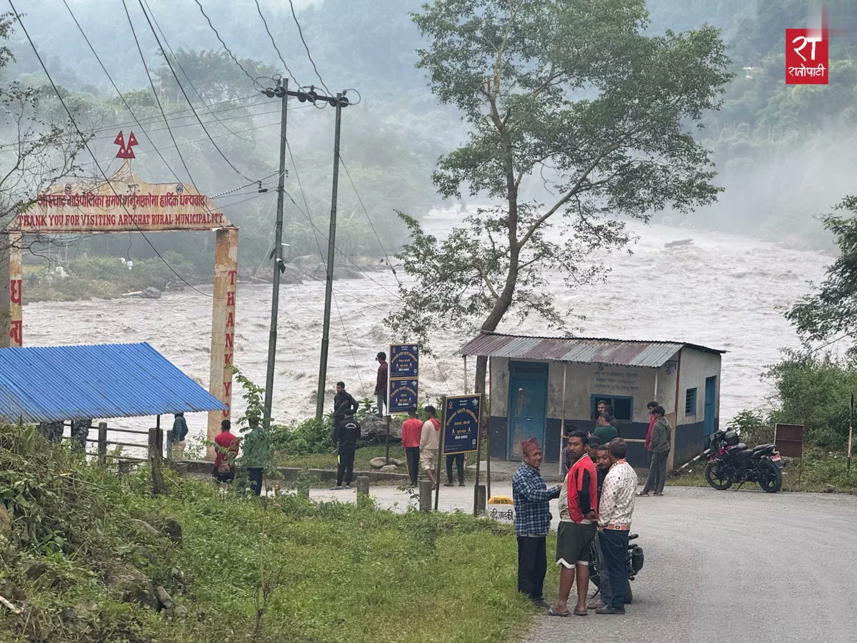 Crews watch the river at the entrance to Arughat (Oct. 11)