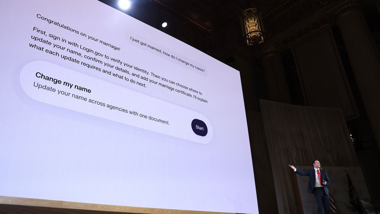A screen demonstrates name-change steps after marriage at the America.gov launch (Sept. 29)