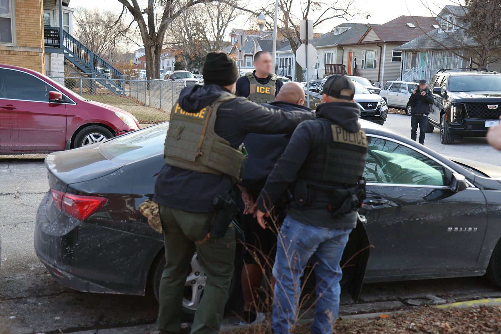 ICE officers detain a person during an operation in Chicago (file, January 2025)