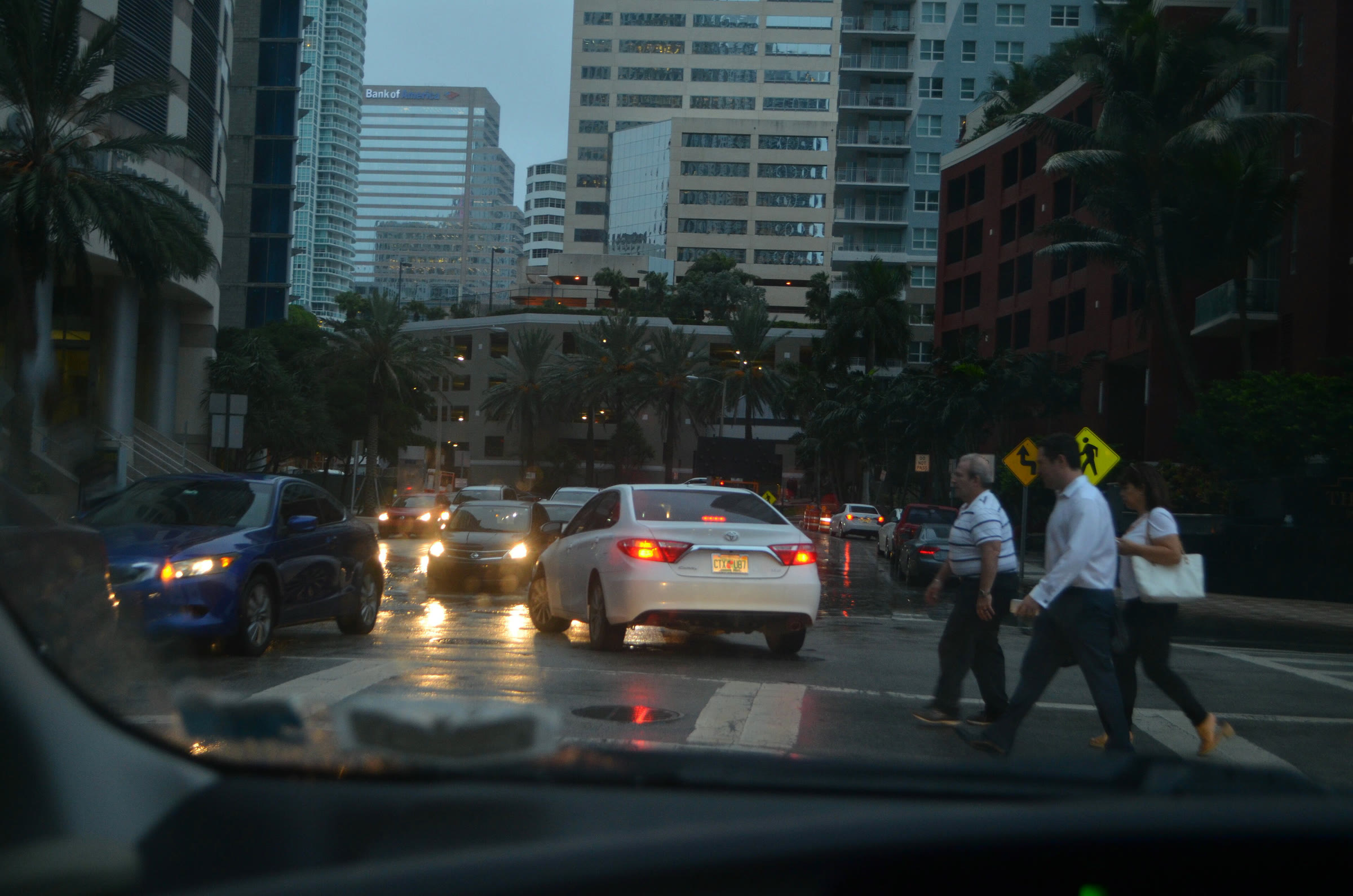 Cars drive through high-tide water on a Miami street (file photo)