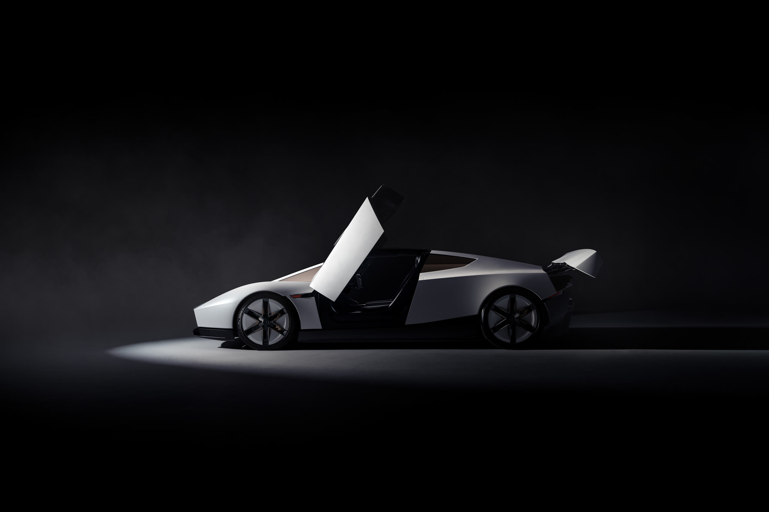 The new Tesla Roadster with its doors raised