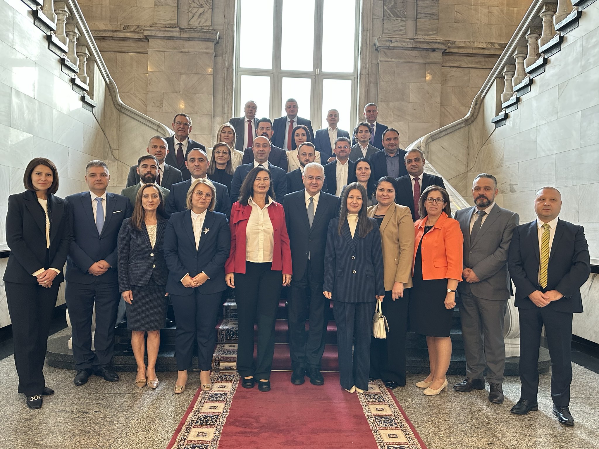 Embassy staff and friendship group members pose for a group photo