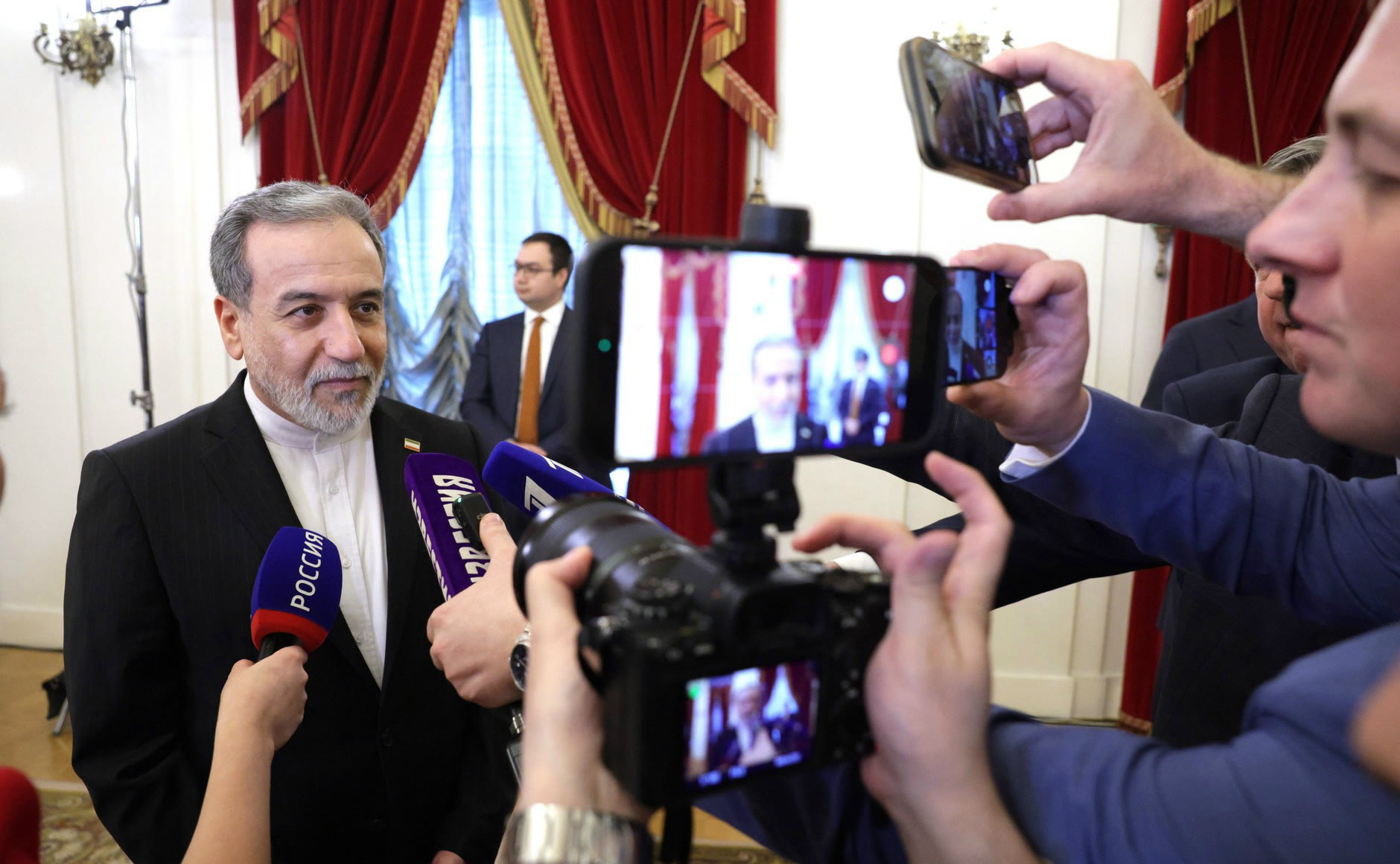 Iranian Foreign Minister Abbas Araghchi speaks to reporters