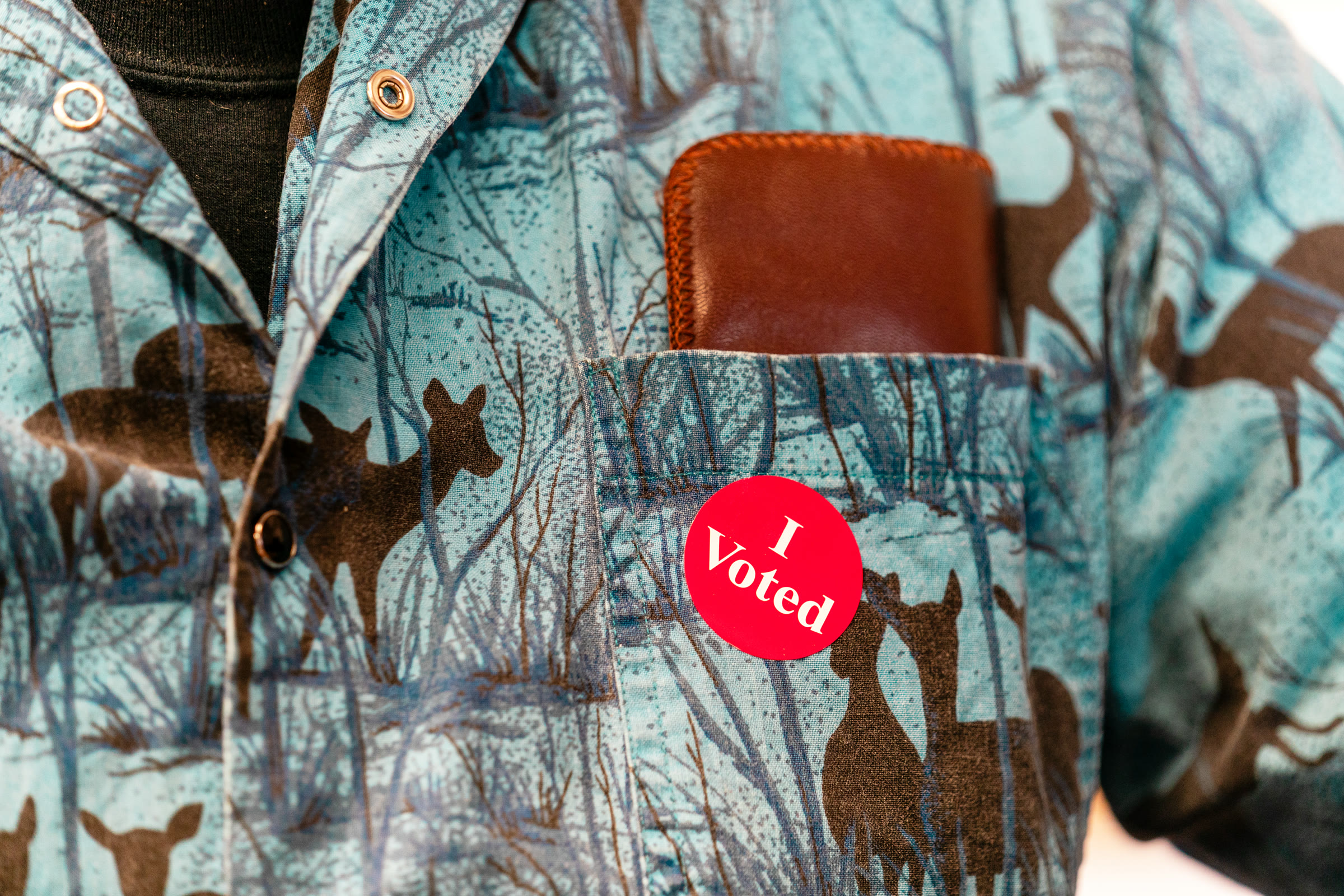 An "I Voted" sticker on a voter's shirt