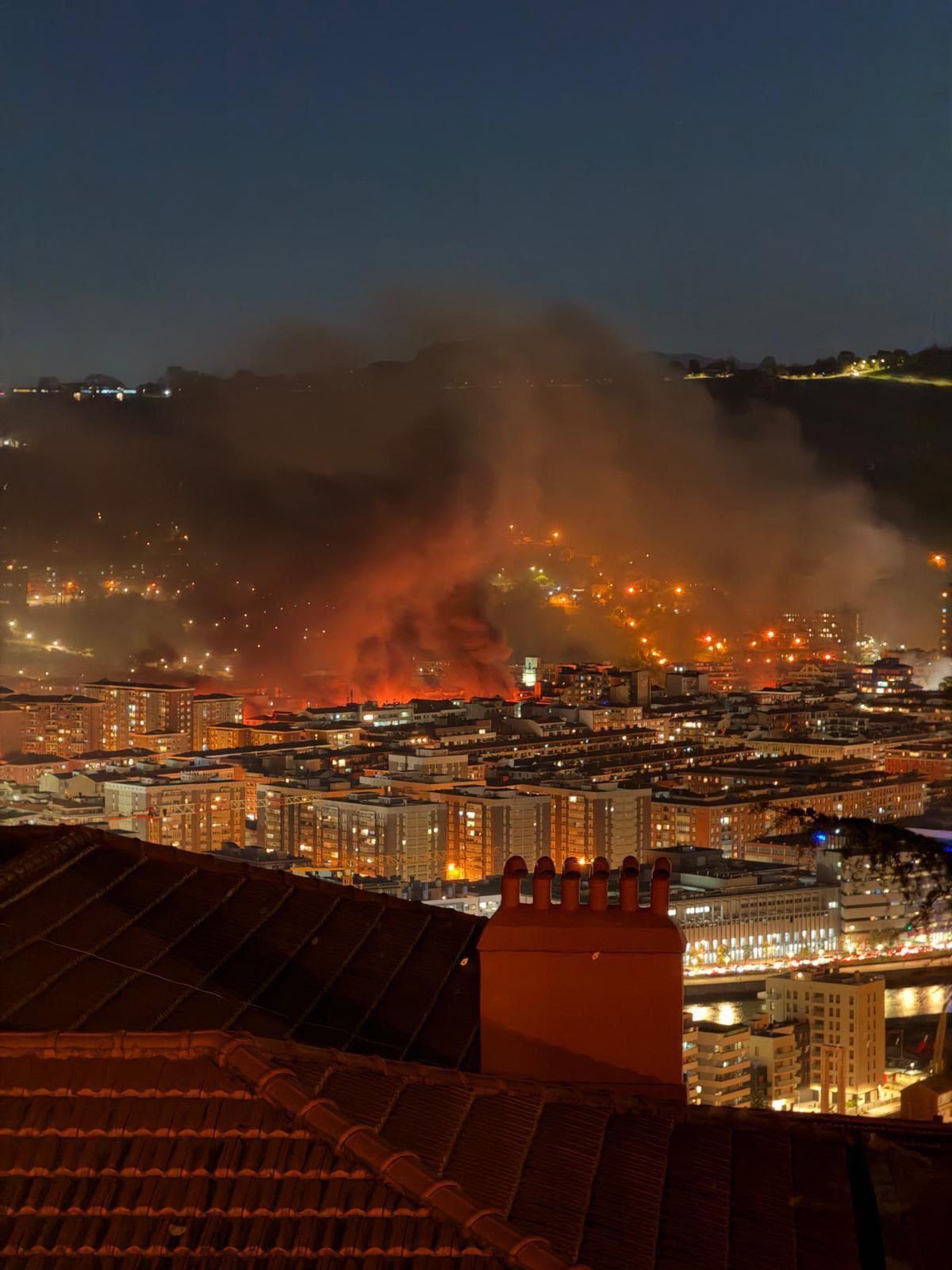 Smoke rises over Bilbao during the unrest