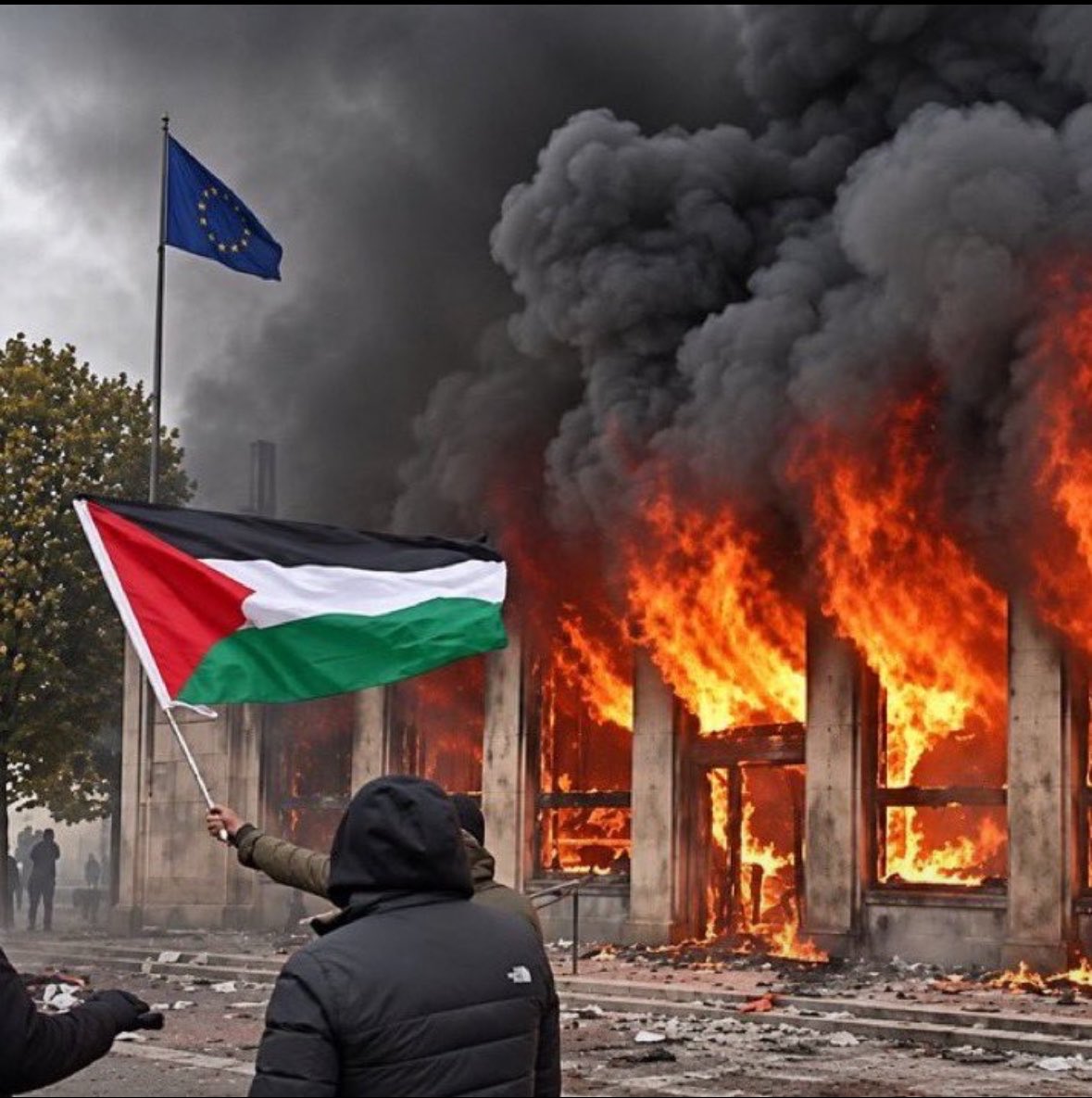 متظاهر يلوّح بالعلم الفلسطيني أمام مبنى يحترق
