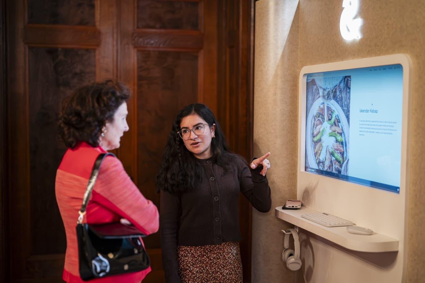 Guests at one of the interactive digital displays