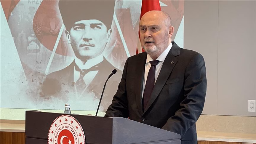 Feridun Sinirlioglu speaks at a podium (AA archive)