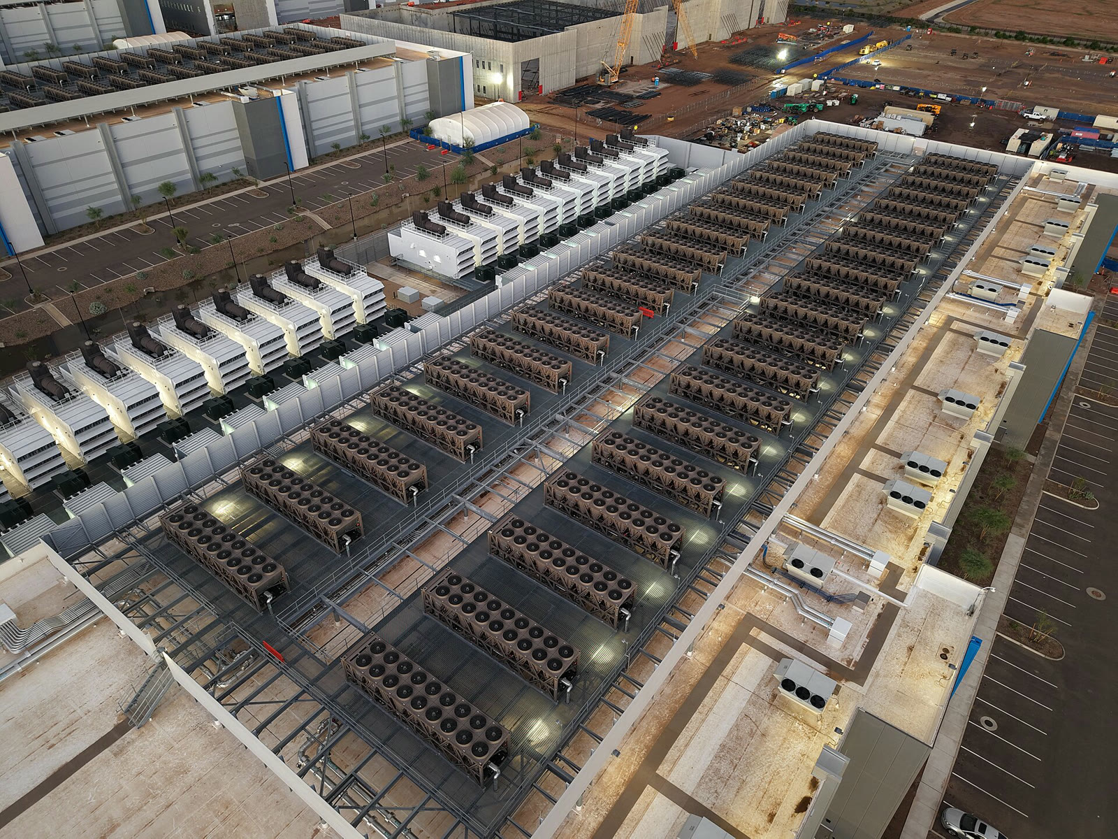 Cooling towers and backup generators on the roof of a data center