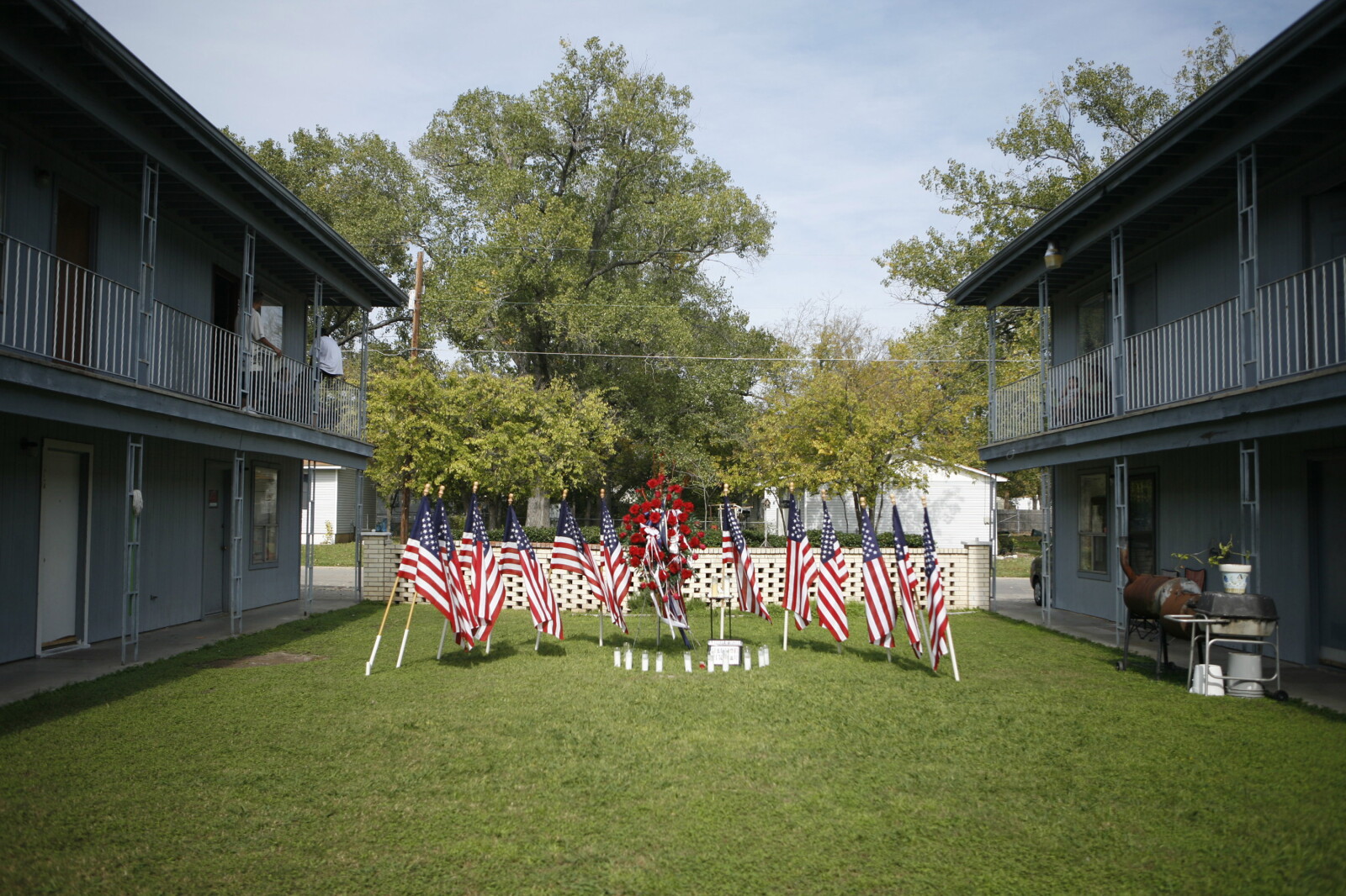 A memorial to the Fort Hood shooting victims outside the apartment complex where Hasan lived, November 2009