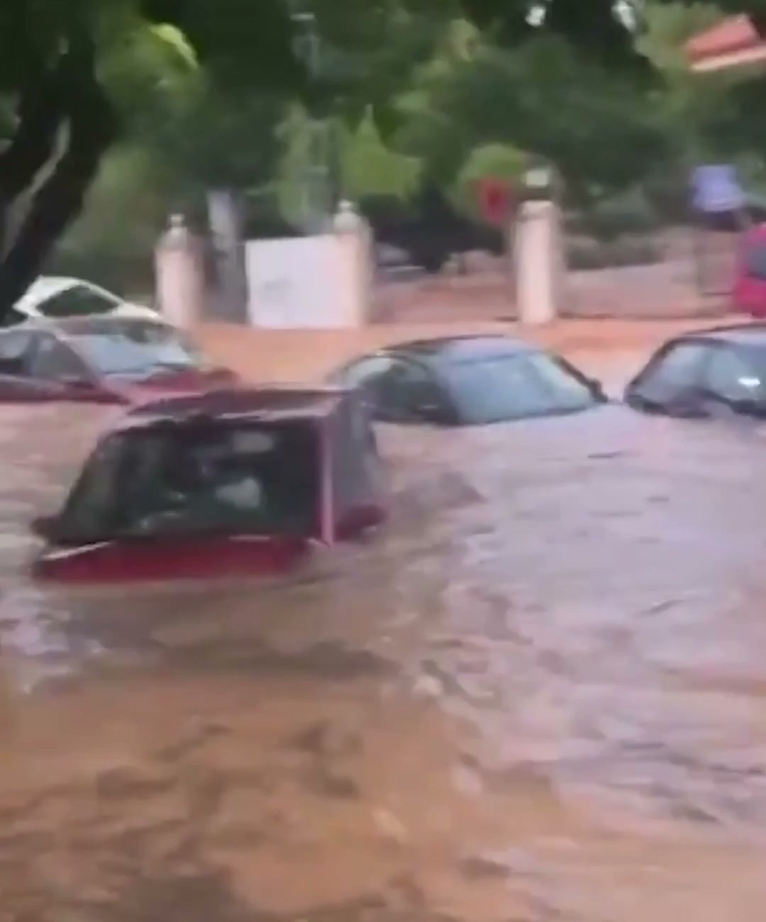 Cars submerged by floodwaters
