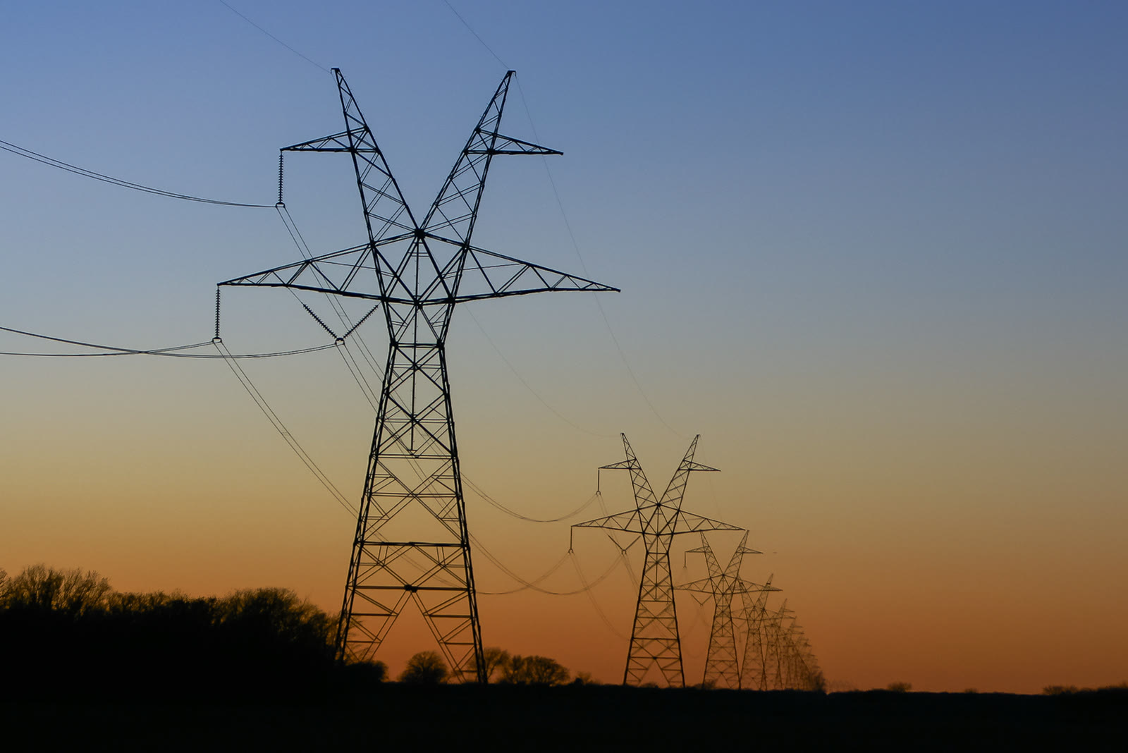 High-voltage transmission towers at sunset (file photo)